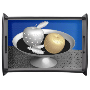 Gold and silver apples on a silver pedestal serving tray