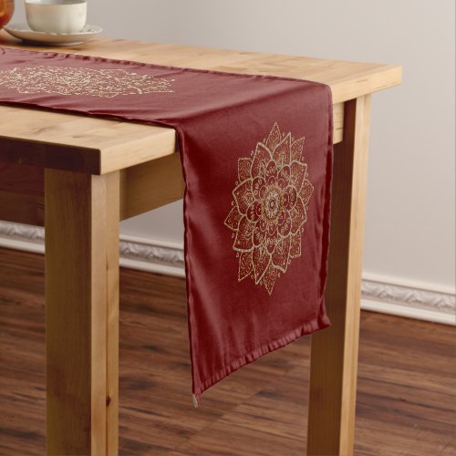 Gold and silver mandala on dark red short table runner