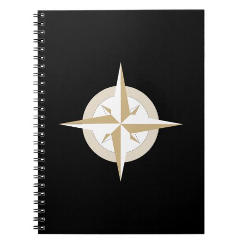 Gold and White Compass on Black Notebook