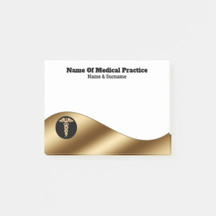 Gold black medical caduceus on white business post-it notes