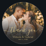 Gold Black Thank You Script Wedding Photo Classic Round Sticker<br><div class="desc">Modern Pretty Black and Gold Calligraphy Script Wedding Thank You | Couple Photo sticker/label for yor gift favor. Featuring an elegant handwritten style calligraphy overlay with text „Thank You” on black gradient.</div>