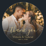 Gold Black Thank You Script Wedding Photo Classic Round Sticker<br><div class="desc">Modern Pretty Black and Gold Calligraphy Script Wedding Thank You | Couple Photo sticker/label for yor gift favor. Featuring an elegant handwritten style calligraphy overlay with text „Thank You” on black gradient.</div>