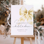 Gold Bow Christmas Bridal Shower Welcome Sign<br><div class="desc">Introducing the Gold Bow Christmas Bridal Shower Welcome Sign, a stunning blend of holiday cheer and bridal elegance. The luxurious gold bow shines against the clean white backdrop, This welcome sign combines modern watercolor details with classic script typography, making it an ideal choice for brides seeking a warm and joyful...</div>