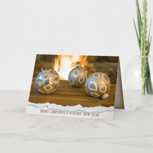 gold Christmas ornaments by fireplace Holiday Card (Front)