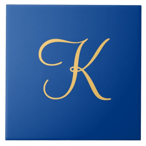 Gold_colored initial K on dark blue background Ceramic Tile