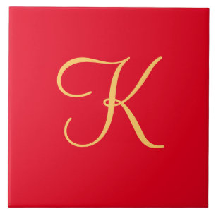 Gold-colored initial K on solid red background Ceramic Tile
