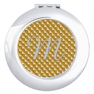 Gold colored, metallic look, studded grid mirror for makeup