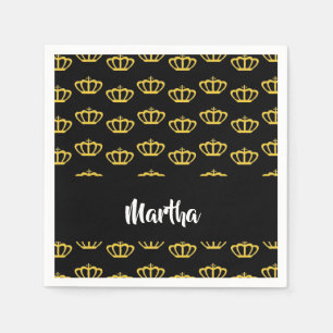 Gold crowns on black napkins