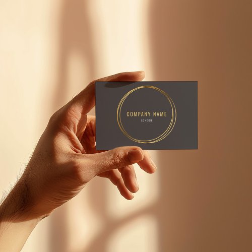 Gold effect gold rings grey background bold text business card