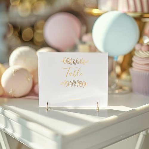 Gold effect leaves table number card