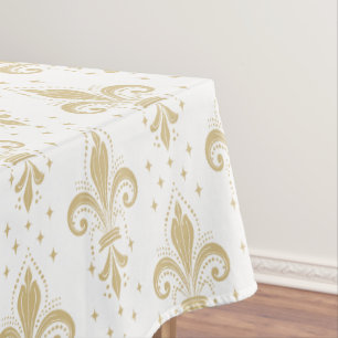 Gold fleur-de-lis seamless pattern on white tablecloth