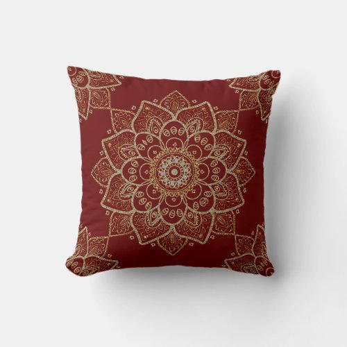 Gold floral mandala on dark red background throw pillow