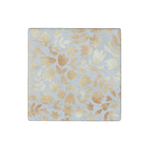 Gold flowers, blue background, foil imitation. stone magnet