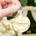 Gold Frills on Cream Bridesmaid Wedding Gift Keychain<br><div class="desc">These keychains are designed to give as favors to bridesmaids in your wedding party. They feature a simple yet elegant design with an ivory or cream colored background, gold script lettering, and a lacy golden faux foil floral border. The text says "Bridesmaid" with space for her name, the names of...</div>