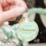 Gold Frills on Mint Green Bridesmaid Wedding Gift Keychain<br><div class="desc">These keychains are designed to give as favors to bridesmaids in your wedding party. They feature a simple yet elegant design with a pale mint green colored background, gold script lettering, and a lacy golden faux foil floral border. The text says "Bridesmaid" with space for her name, the names of...</div>