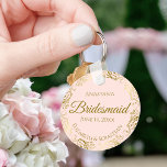 Gold Frills on Pink Bridesmaid Wedding Gift Keychain<br><div class="desc">These keychains are designed to give as favors to bridesmaids in your wedding party. They feature a simple yet elegant design with a pale blush pink colored background, gold script lettering, and a lacy golden faux foil floral border. The text says "Bridesmaid" with space for her name, the names of...</div>