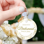 Gold Frills on White Bridesmaid Wedding Gift  Keychain<br><div class="desc">These keychains are designed to give as favors to bridesmaids in your wedding party. They feature a simple yet elegant design with a classic white background, gold script lettering, and a lacy golden faux foil floral border. The text says "Bridesmaid" with space for her name, the names of the couple,...</div>
