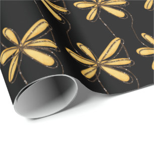 gold glitter daisy on black wrapping paper