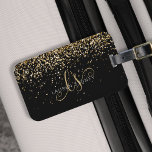 Gold Glitter Glam Monogram Name Luggage Tag<br><div class="desc">Glam Gold Glitter Elegant Monogram Luggage Tag. Easily personalize this trendy chic luggage tag design featuring elegant gold sparkling glitter on a black background. The design features your handwritten script monogram with pretty swirls and your name.</div>