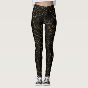 Gold glitter in black background leggings