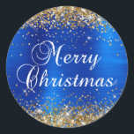 Gold Glitter Royal Blue Foil Merry Christmas Classic Round Sticker<br><div class="desc">Fancy calligraphy Merry Christmas envelope seal stickers for your special holiday greetings or invite.
Girly faux sparkly gold glitter over a faux royal blue brushed metal style ombre foil.
The color of the old-fashioned text graphic can be changed.</div>