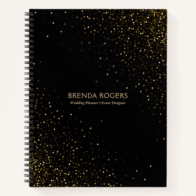 Gold glitter sparkles on black notebook (Front)