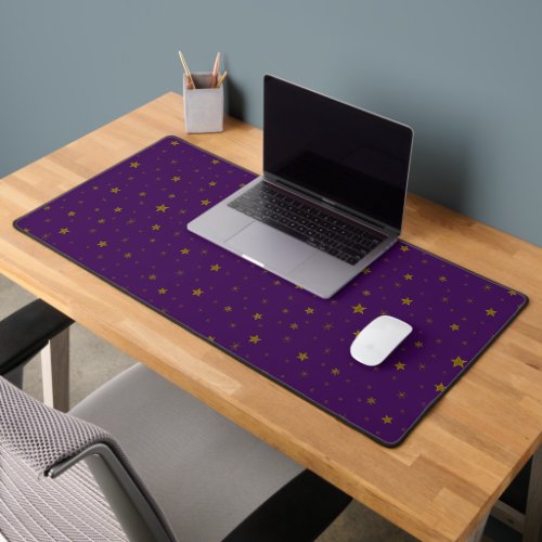 Gold glitter stars on purple background desk mat