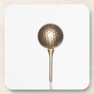 Gold golf ball and tee beverage coaster