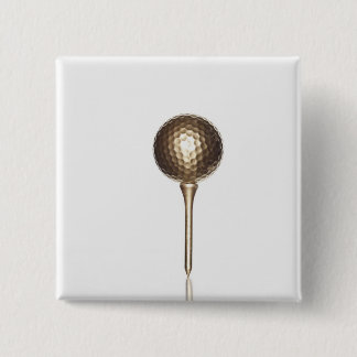 Gold golf ball and tee pinback button