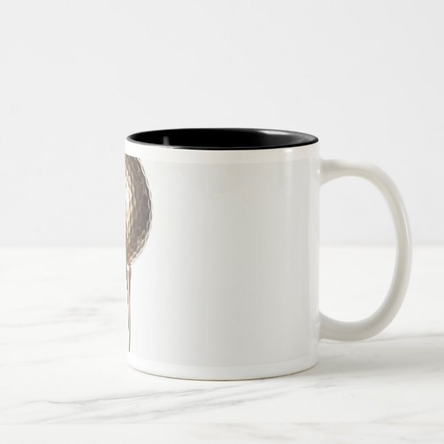 Gold golf ball and tee Two-Tone coffee mug (Right)