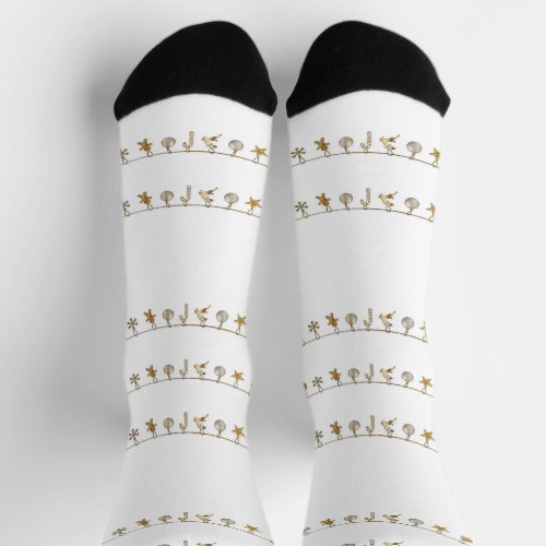 Gold hanging Xmas ornaments on white Socks