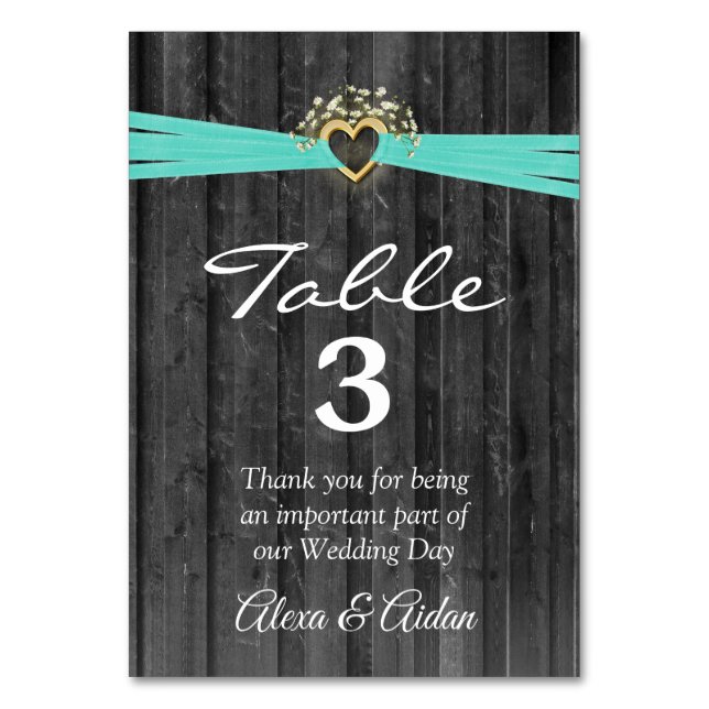 Gold Heart with Turquoise Ribbon On Gray Wood Table Number (Front)