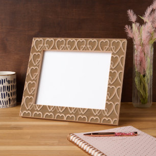 Gold hearts on maroon engraved frames