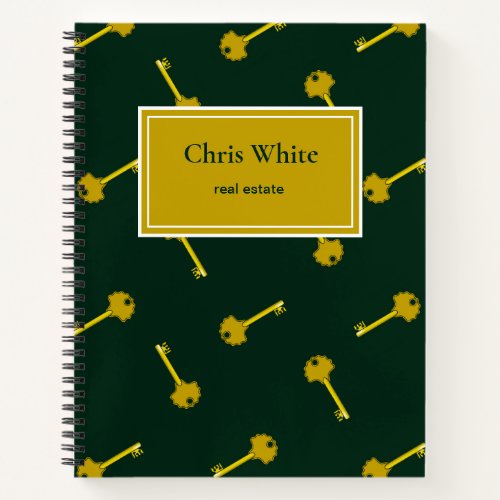 Gold house keys dark green notebook