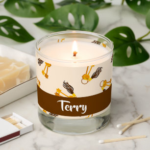 Gold house keys on pink scented candle