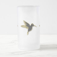 Gold Hummingbird with wings stretched out