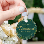 Gold Lace Bridesmaid Wedding Gift Emerald Green Keychain<br><div class="desc">These keychains are designed to give as favors to bridesmaids in your wedding party. They feature a simple yet elegant design with an emerald green background,  gold lettering,  and a golden faux foil floral lace border. Perfect way to thank your bridesmaids for being a part of your special day!</div>