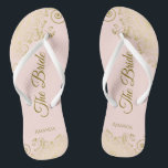 Gold Lace on Blush Pink The Bride Elegant Wedding Flip Flops<br><div class="desc">Dance the night away with these beautiful wedding flip flops. Designed for the bride, they feature a simple yet elegant design with gold colored script lettering on a light blush pink background and fancy golden lace curls and swirls. Beautiful way to stay fancy and appropriate while giving your feet a...</div>