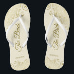 Gold Lace on Ivory Cream The Bride Elegant Wedding Flip Flops<br><div class="desc">Dance the night away with these beautiful wedding flip flops. Designed for the bride, they feature a simple yet elegant design with gold colored script lettering on an ivory or cream colored background and fancy golden lace curls and swirls. Beautiful way to stay fancy and appropriate while giving your feet...</div>