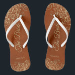 Gold Lace on Rust Orange Elegant The Bride Wedding Flip Flops<br><div class="desc">Dance the night away with these beautiful wedding flip flops. Designed for the bride, they feature a simple yet elegant design with gold colored script lettering on a rust orange or burnt umber colored background and fancy golden lace curls and swirls. Beautiful way to stay fancy and appropriate while giving...</div>