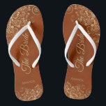Gold Lace on Rust Orange Elegant The Bride Wedding Flip Flops<br><div class="desc">Dance the night away with these beautiful wedding flip flops. Designed for the bride, they feature a simple yet elegant design with gold colored script lettering on a rust orange or burnt umber colored background and fancy golden lace curls and swirls. Beautiful way to stay fancy and appropriate while giving...</div>