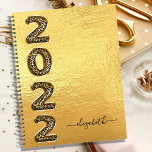 Gold leopard animal pattern monogram 2022 metal planner<br><div class="desc">A stylish faux gold metallic lookint background. Personalize and add a name. Year 2022 is written with large balloon style font with faux gold leopard, animal pattern. The name is written with a modern hand lettered style script with swashes. To keep the swashes only delete the sample name, leave the...</div>