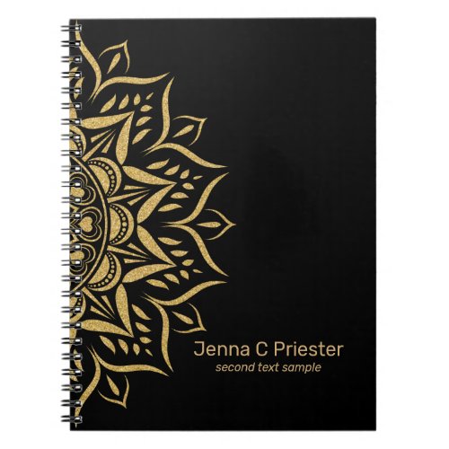 Gold mandala hearts and swirls on black notebook