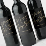 Gold Merry Christmas Black<br><div class="desc">Merry Christmas in a faux gold foil script and your names in chic lettering,  these black wine bottle labels are stylish for Christmas gifts or to label wine served at your holiday occasion.</div>