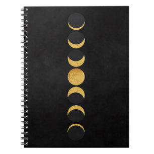 Gold moon phases black textured background notebook