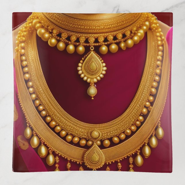 Gold Necklace Trinket Trays (A traditional Indian gold necklace set against a deep red background.)