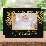 Gold Palms Black Tropical Christmas Photo Holiday Card<br><div class="desc">Glamorous faux gold glitter palm fronds on a black background highlight your favorite photo on these holiday Christmas photo cards. Merry Christmas and your names on the bottom in chic lettering. High Definition for best quality. MORE COLORS and multi-photo style done for you in our collection.</div>