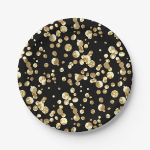 Gold polka dots on a black background . paper plat plates