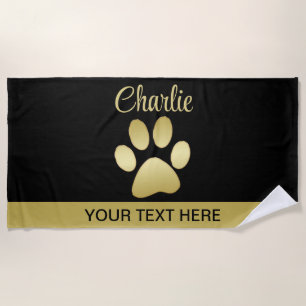 Gold Shiny Dog Paw on black background Beach Towel