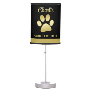 Gold Shiny Dog Paw on black background Table Lamp